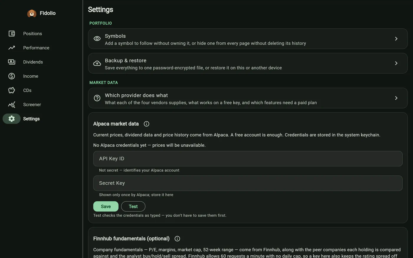 Fidolio's Settings screen: Portfolio and Market data groups, with credential cards for Alpaca and Finnhub and a guide to which provider does what