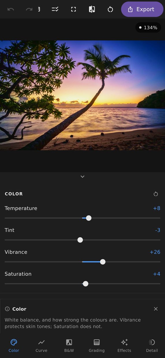 The Colour panel open on a phone, showing temperature, tint, vibrance and saturation